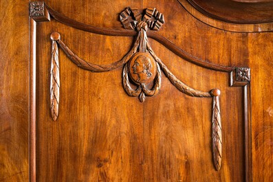 A Dutch mahogany veneered cabinet with two doors and three drawers, 18th C.