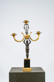 A French gilt and patinated bronze three-light candelabra, 19th C.