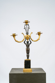 A French gilt and patinated bronze three-light candelabra, 19th C.