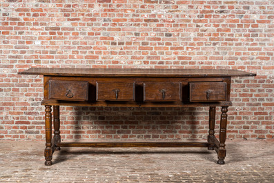 A four-drawer southern European walnut table, 18th C. and later