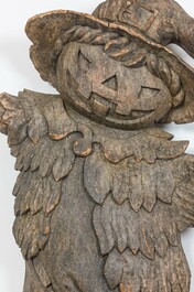 A large wooden carving of a Halloween-themed pumpkin head figure, mid 20th C.