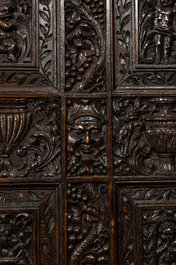A richly sculpted two-panel French oak room divider with Japonism embroidery, France, 19th C.