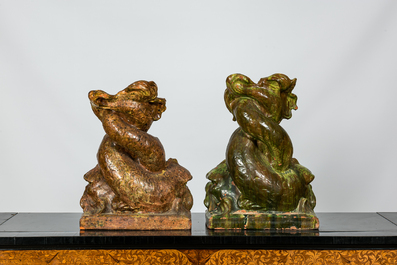 A pair of large Italian glazed terracotta sculptures of entwined dolphins, 20th C.
