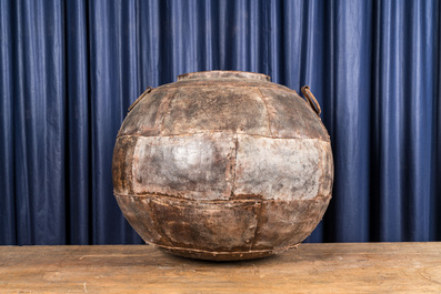 A spherical cauldron consisting of several iron plates, 19/20th C.