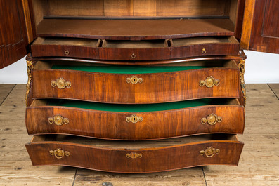 A Dutch mahogany veneered cabinet with two doors and three drawers, 18th C.