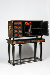 An ebonised wooden cabinet with faux-tortoiseshell veneer, 19th C.