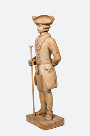A bleached oak wooden sculpture of a gentleman, 20th C.