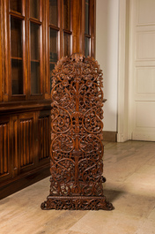 A richly carved oak etag&egrave;re with floral design, probably Italy, 19th C.