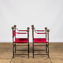A pair of Italian wrought iron Savonarola chairs with brass mounts and velvet upholstery, 20th C.