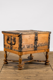 Een dennenhouten koffer met smeedijzeren beslag op voet, gedateerd 1661, 17e eeuw en later