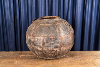 A spherical cauldron consisting of several iron plates, 19/20th C.