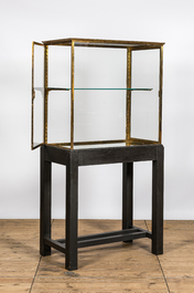 A French brass display cabinet on later wooden stand, 20th C.