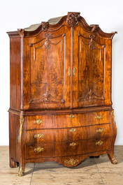 A Dutch mahogany veneered cabinet with two doors and three drawers, 18th C.