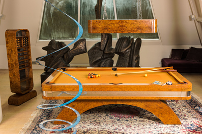 A burl wood veneered billiard table with accompanying lighting and cue holder, 20th C.