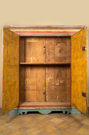 A pair of large Italian polychrome wooden two-door cupboards with coats of arms, 17th C.