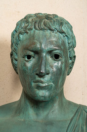 A large green patinated bronze bust of a Roman, 20th C.