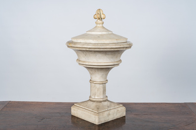 A white marble urn with floral top, 20th C.