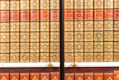 Two trompe l'oeil cupboard doors with book bindings, 1st half 20th C.