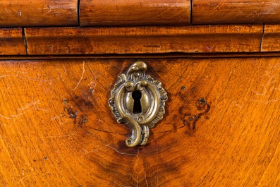 A Dutch mahogany veneered cabinet with two doors and three drawers, 18th C.