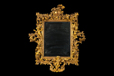 An impressive Italian gilt wooden baroque-style mirror with cherubs, 19th C.