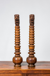 A pair of Italian baluster-shaped elements topped with lions' heads, 17/18th C. and later