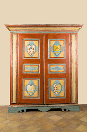 A pair of large Italian polychrome wooden two-door cupboards with coats of arms, 17th C.