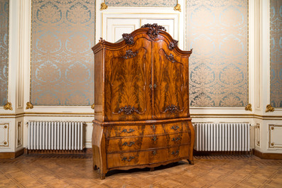 A Dutch mahogany veneered cabinet with two doors and three drawers, 18th C.