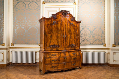 A Dutch mahogany veneered cabinet with two doors and three drawers, 18th C.