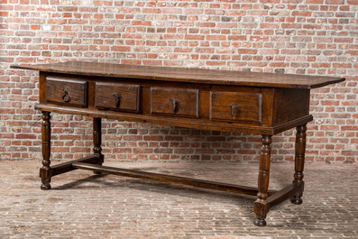 A four-drawer southern European walnut table, 18th C. and later