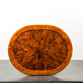 An oval side table with rootwood veneer and parquetry, 20th C