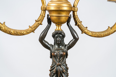 A French gilt and patinated bronze three-light candelabra, 19th C.