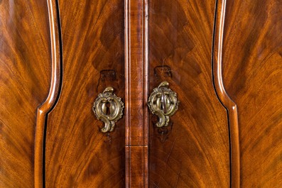A Dutch mahogany veneered cabinet with two doors and three drawers, 18th C.