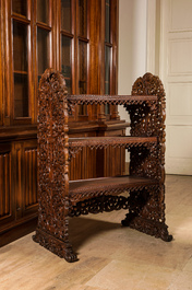 A richly carved oak etag&egrave;re with floral design, probably Italy, 19th C.