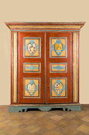 A pair of large Italian polychrome wooden two-door cupboards with coats of arms, 17th C.