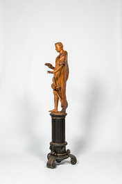 A basswooden allegorical 'Spring' figure on an ebonised neoclassical wooden base, 18/19th C.