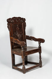 An English walnut and oak wooden armchair, 18th C.