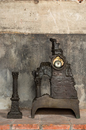 A French patinated and gilt bronze 'ruin' clock with matching candlestick, 19th C.