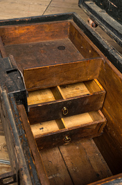 An iron-mounted wooden trunk with interior compartments, 17/18th C.