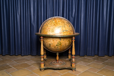 A celestial globe on a polychrome wooden base, 19th C.
