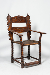 A walnut armchair with wicker upholstery, 19th C.