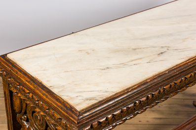 A richly carved wooden wall console with marble top, 19th C.