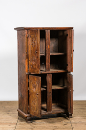 A wooden four-door cupboard with geometrical roundels, Southern Europe, 18/19th C.