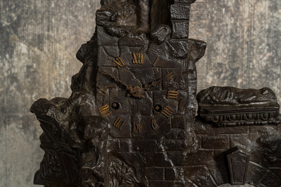 A French patinated and gilt bronze 'ruin' clock with matching candlestick, 19th C.