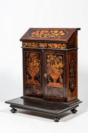 A mahogany floral marquetry secretaire on foot, 19th C. and earlier