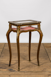 A Louis XV-style bronze mounted walnut table display case with polychrome floral design, 19th C.