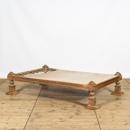 A presumably Indian wooden resting bed with traces of polychromy, 20th C.