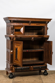 A Dutch partly ebonised oak four-door cupboard, 19th C.