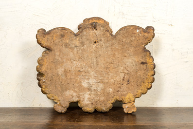 A polychrome wooden cartouche with an angel's head and a blazon, 17th C.