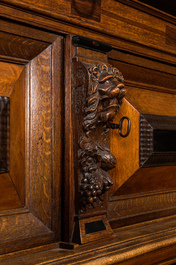 A Dutch partly ebonised oak four-door cupboard, 19th C.