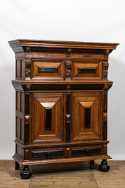 A Dutch partly ebonised oak four-door cupboard, 19th C.